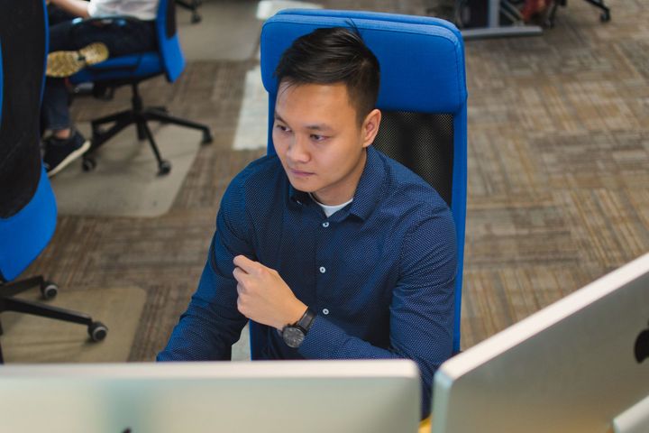 An EDsuite employee at a computer